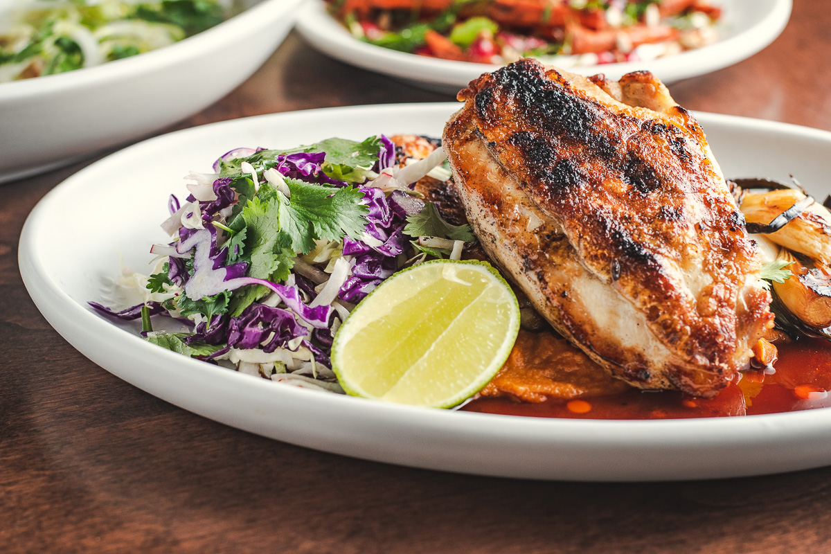 Tito & Pep signature dishes  Wood-Grilled Chicken, Smoked Brisket, various seasonal vegetable dishes prepared on the grill, fresh ceviches, inventive small plates.
